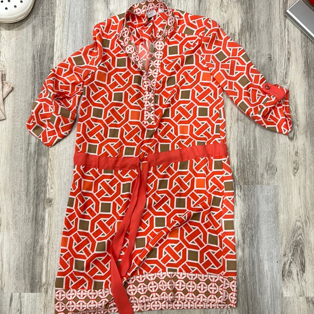 A  cute but elegant dress for any occasion needed. Worn once. A coral color!
